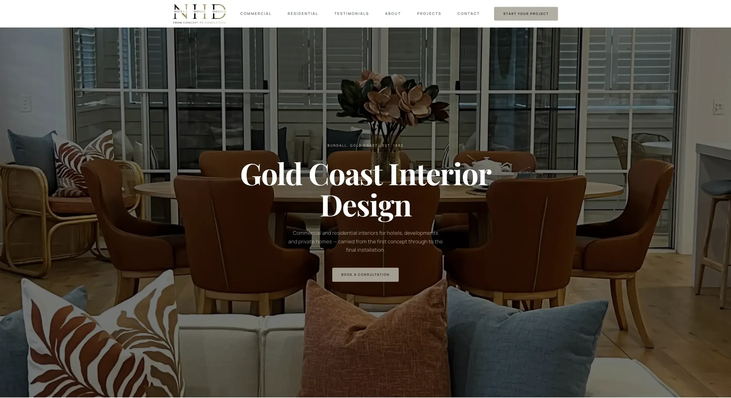 Noble House Design website homepage, showing the Gold Coast Interior Design hero over a styled dining and living space