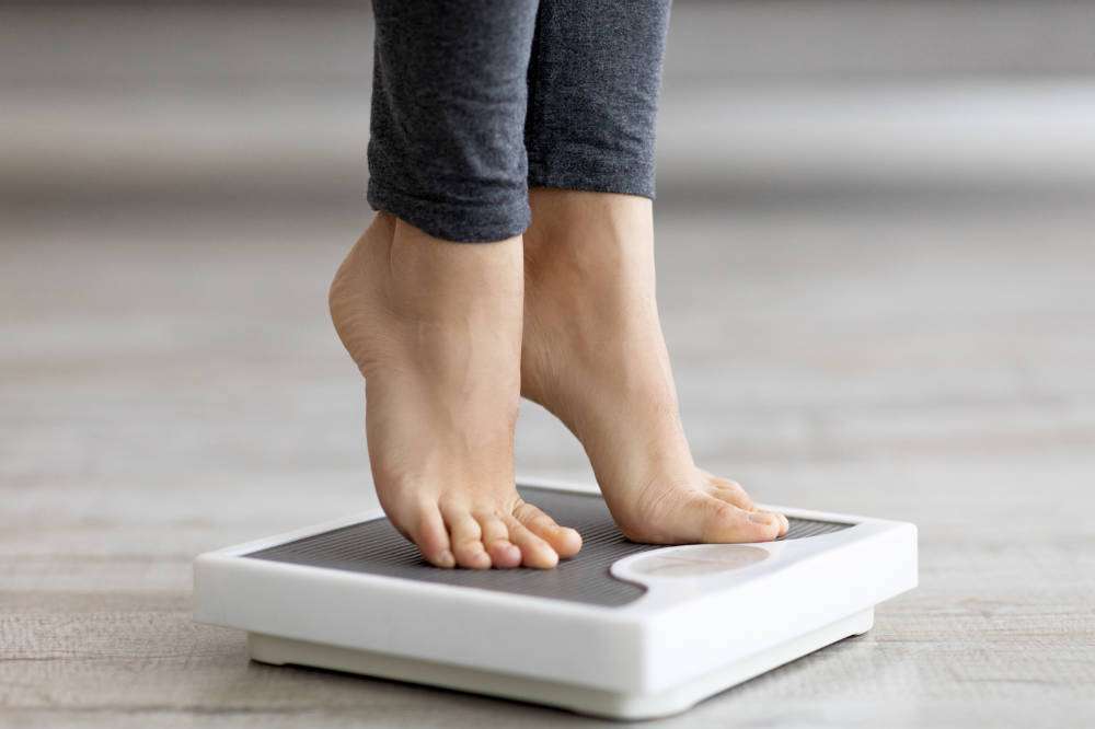 Close of woman on scales