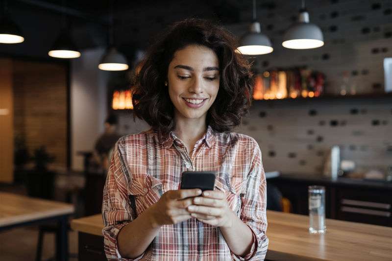 A Young Woman Giving A Customer A Review